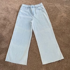 Wide leg pinstripe cropped jeans.